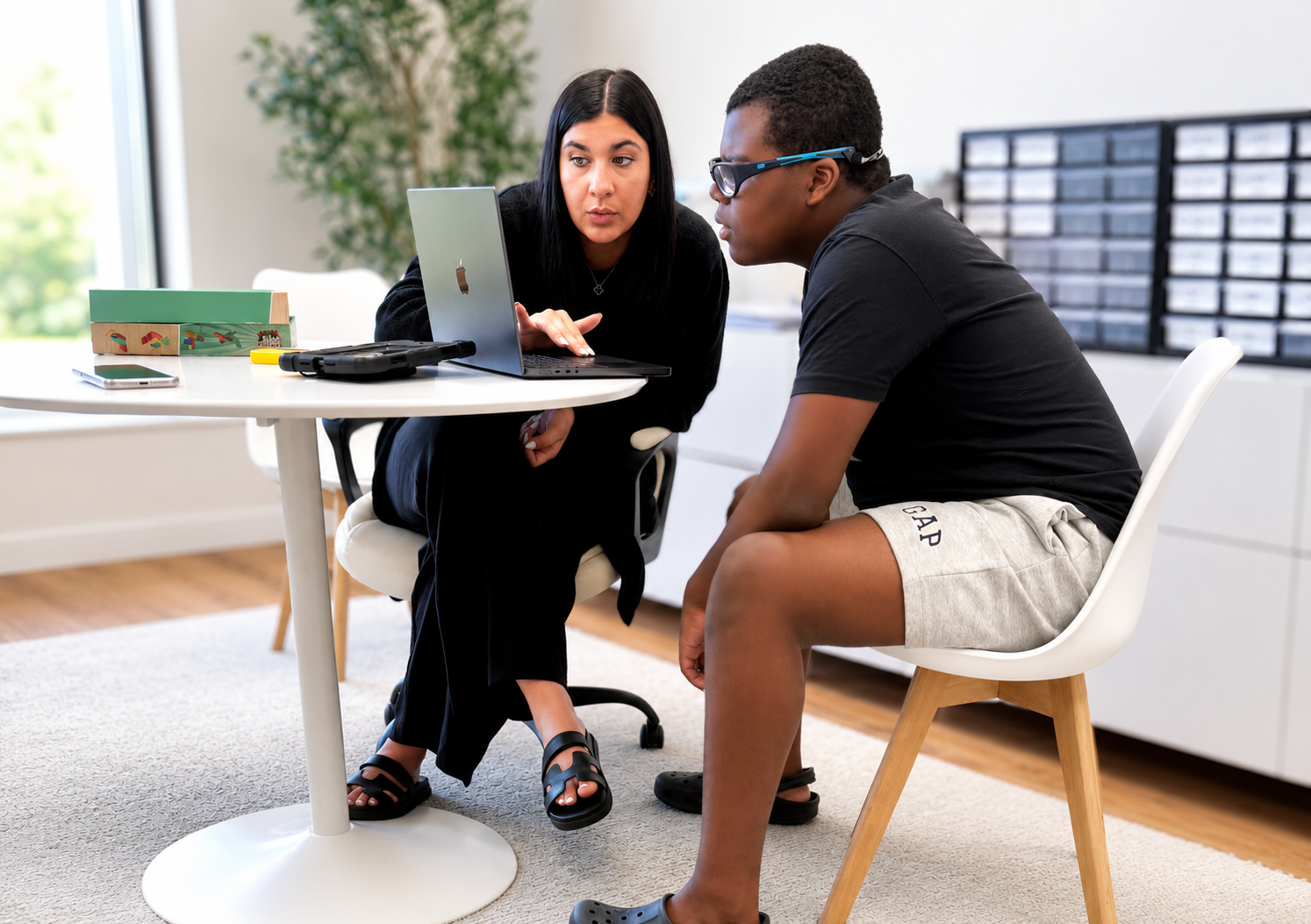 A support professional providing individualized skill-building support