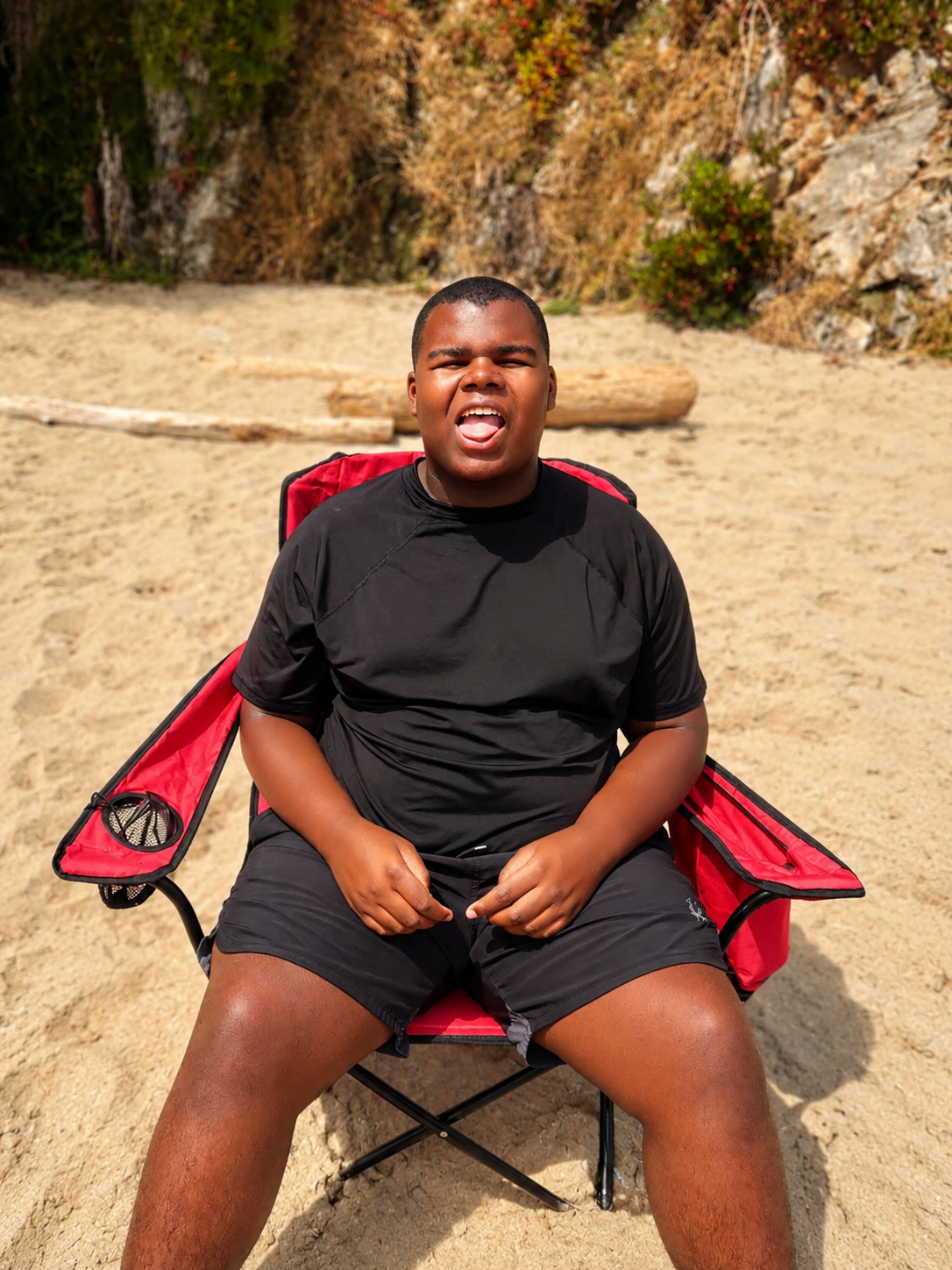 A client enjoying a supported recreational outing at the beach